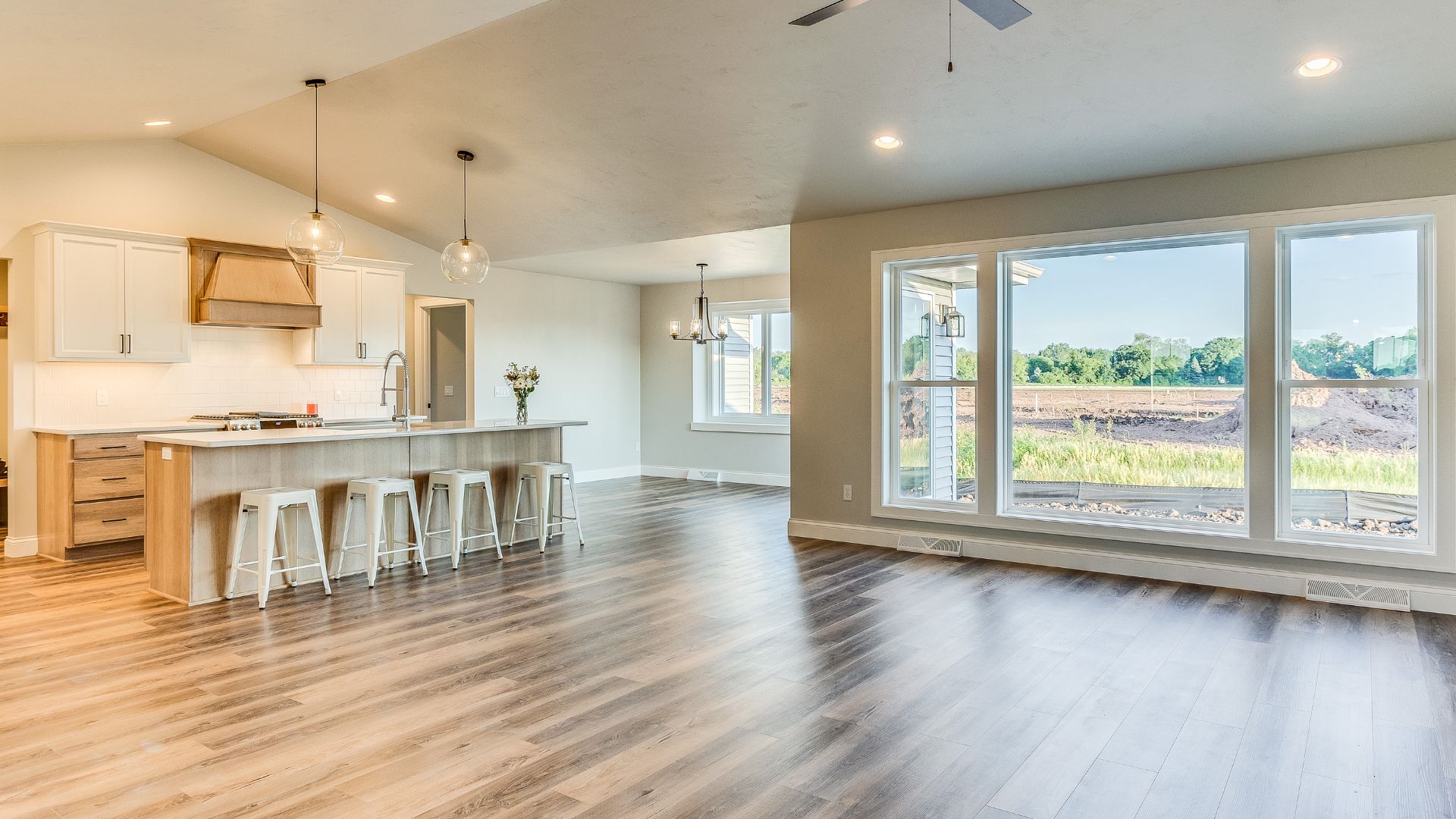 A large open floor plan with a kitchen and living room